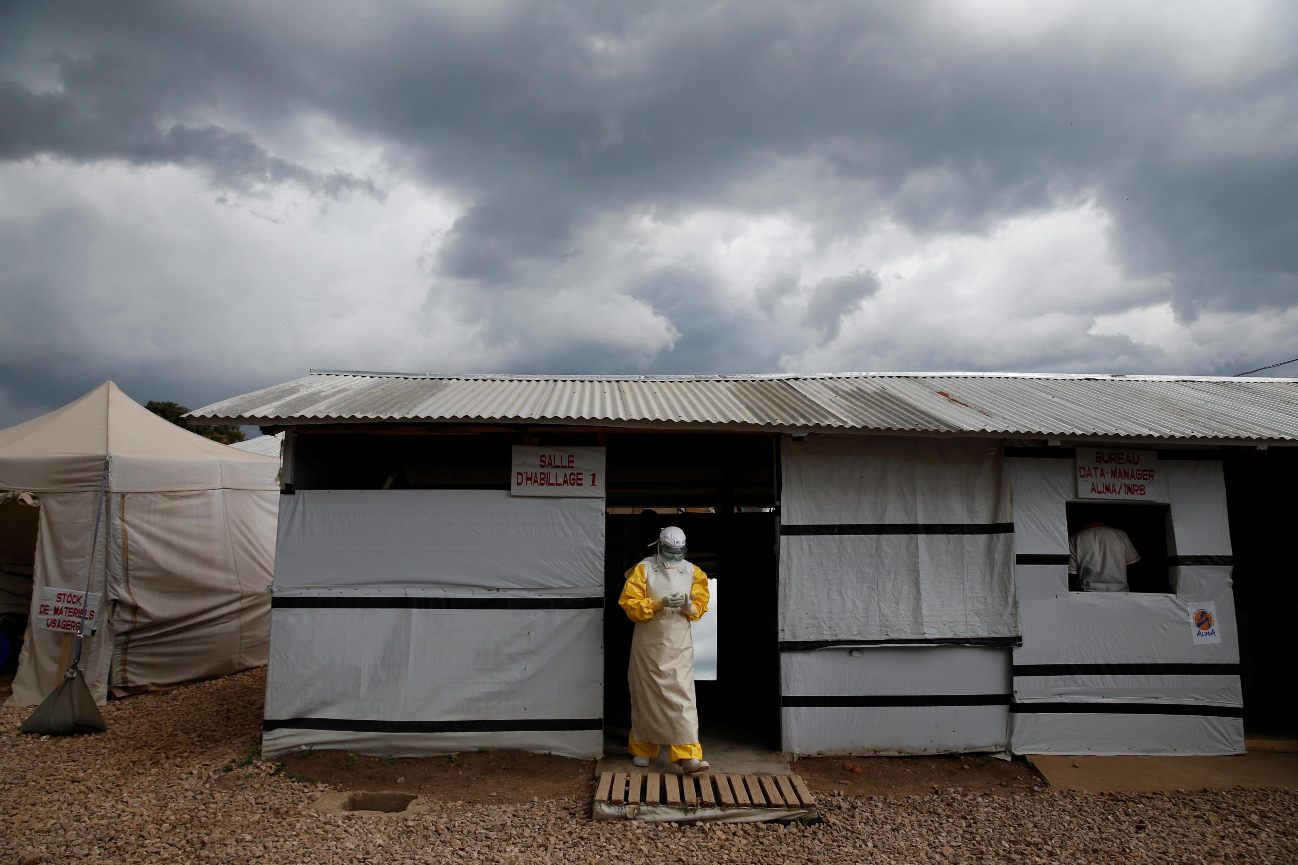 A health worker wearing Ebola protection gear, leaves the dressing room before entering the Biosecure Emergency Care Unit (CUBE) at the ALIMA (The Alliance for International Medical Action) Ebola treatment centre in Beni, in the Democratic Republic of Congo, March 30, 2019.