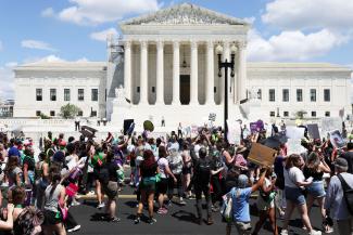 Abortion rights demonstrators rally to mark the first anniversary of the U.S. Supreme Court ruling in the Dobbs v Women's Health Organization case.