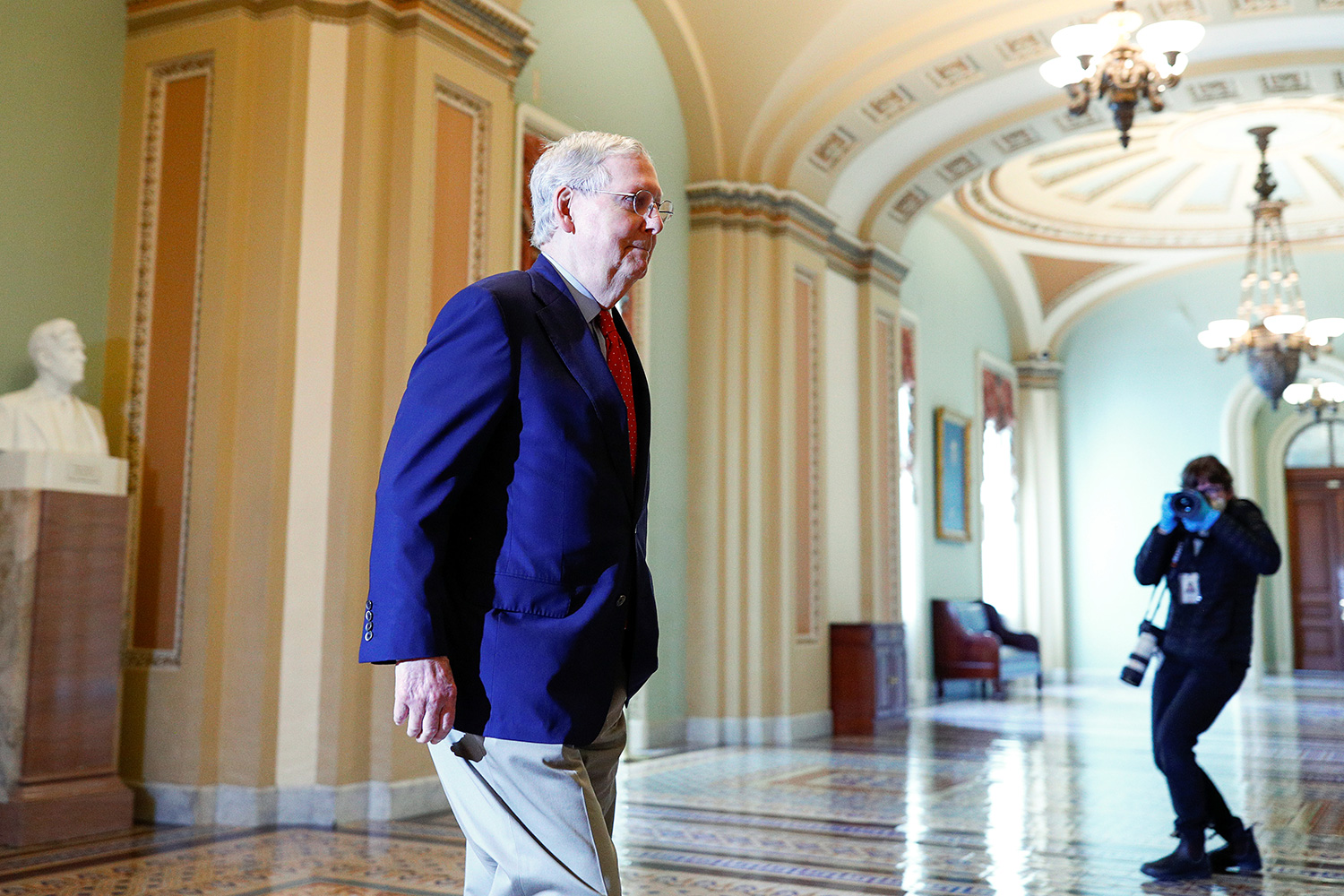 The photo shows the majority leader arriving to work and walking through the beautiful Ohio clock corridor of the capitol. 