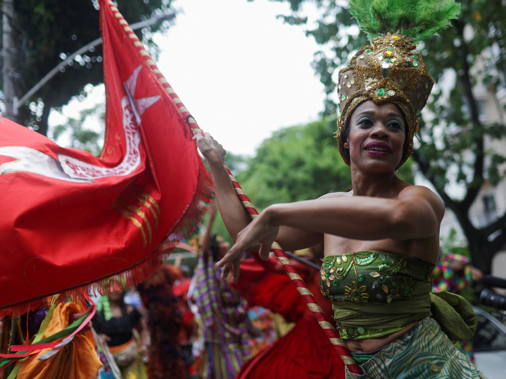 Revelers take part in Loucura Suburbana, an annual block party organized by Nise da Silveira Mental Health Institute during pre-carnival festivities in Rio de Janeiro, Brazil