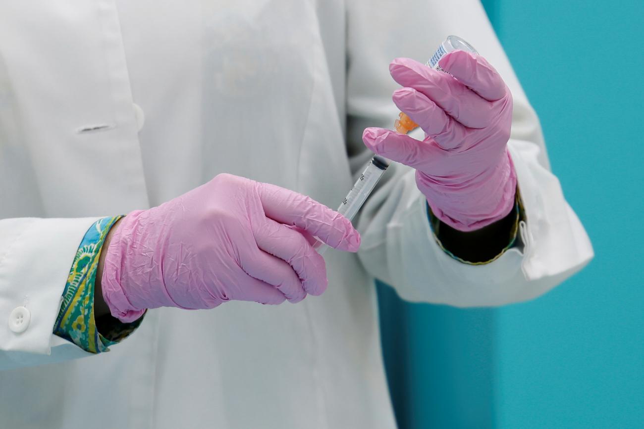 Pharmacist Zaineb Hassan prepares the second dose of the Moderna COVID-19 vaccine for Canada's Prime Minister Justin Trudeau at a pharmacy in Ottawa, Ontario, Canada on July 2, 2021. REUTERS photo by Blair Gable