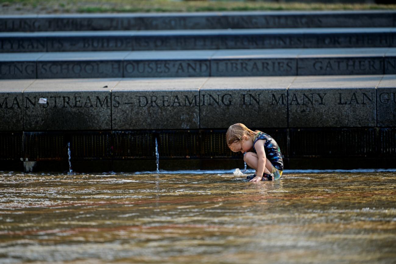 Tommy Hubbard cools off in a public fountain during a heatwave in Portland, Oregon, on August 12, 2021.