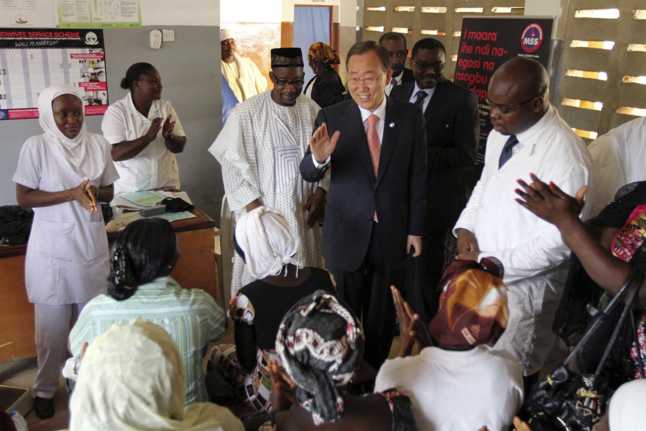 UN Secretary-General Ban Ki-moon speaks to women before he unveils a primary health care clinic in Dutse Makaranta village, on the outskirt of Nigeria's capital Abuja May 23, 2011. 