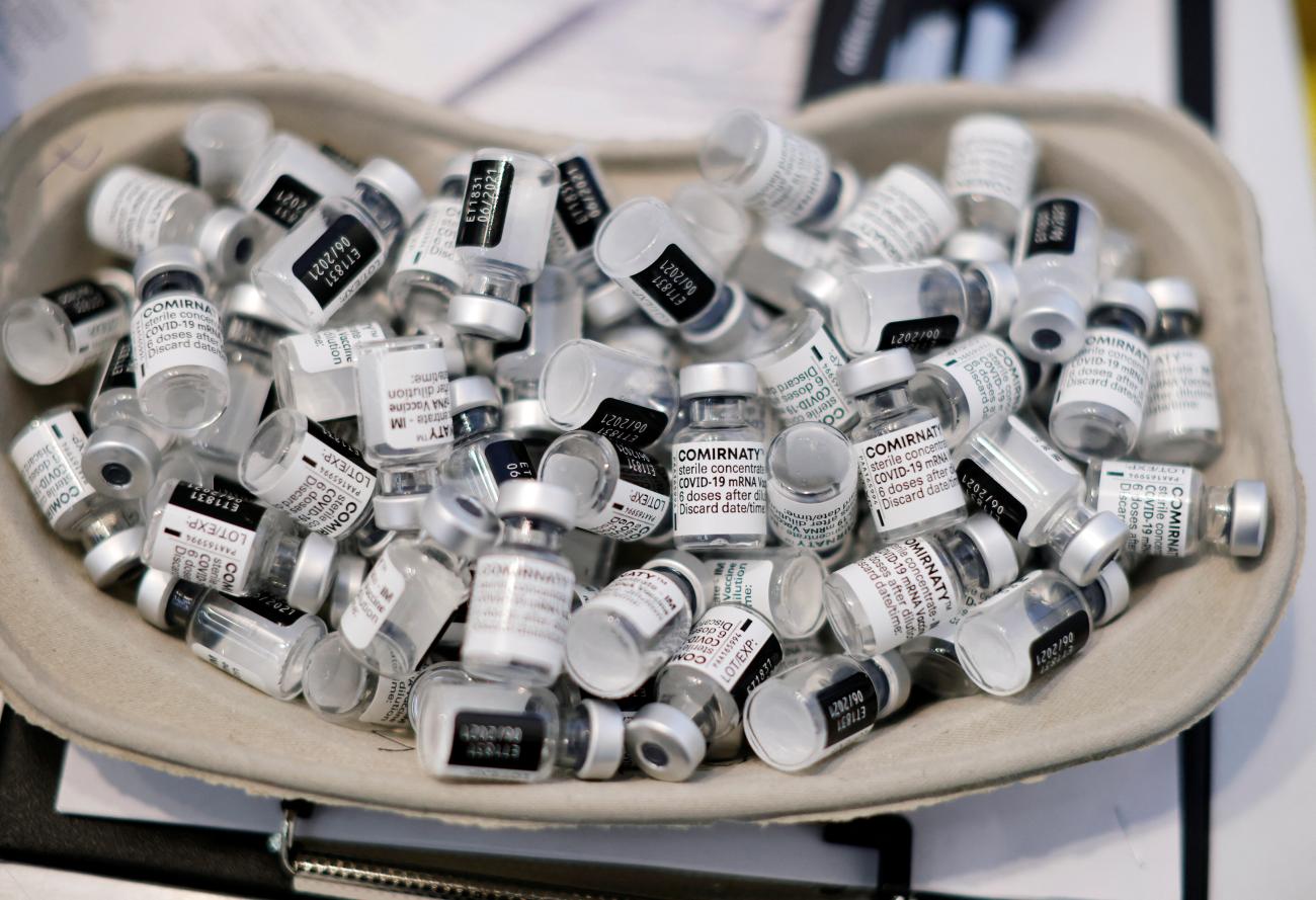 Empty vials of the COVID-19 vaccine are seen during a vaccination campaign.