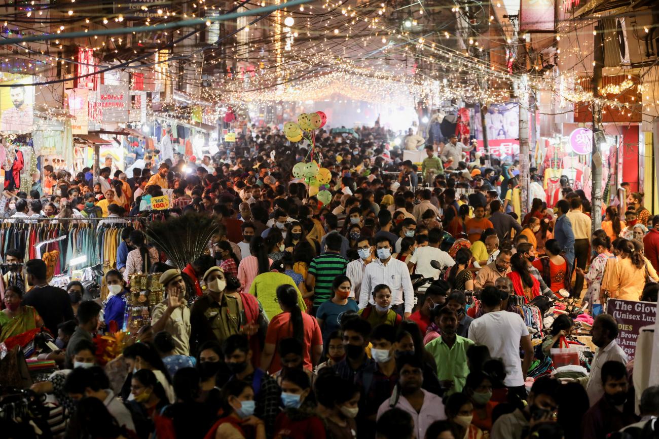 People shop at a crowded market ahead of Diwali, the Hindu festival of lights.