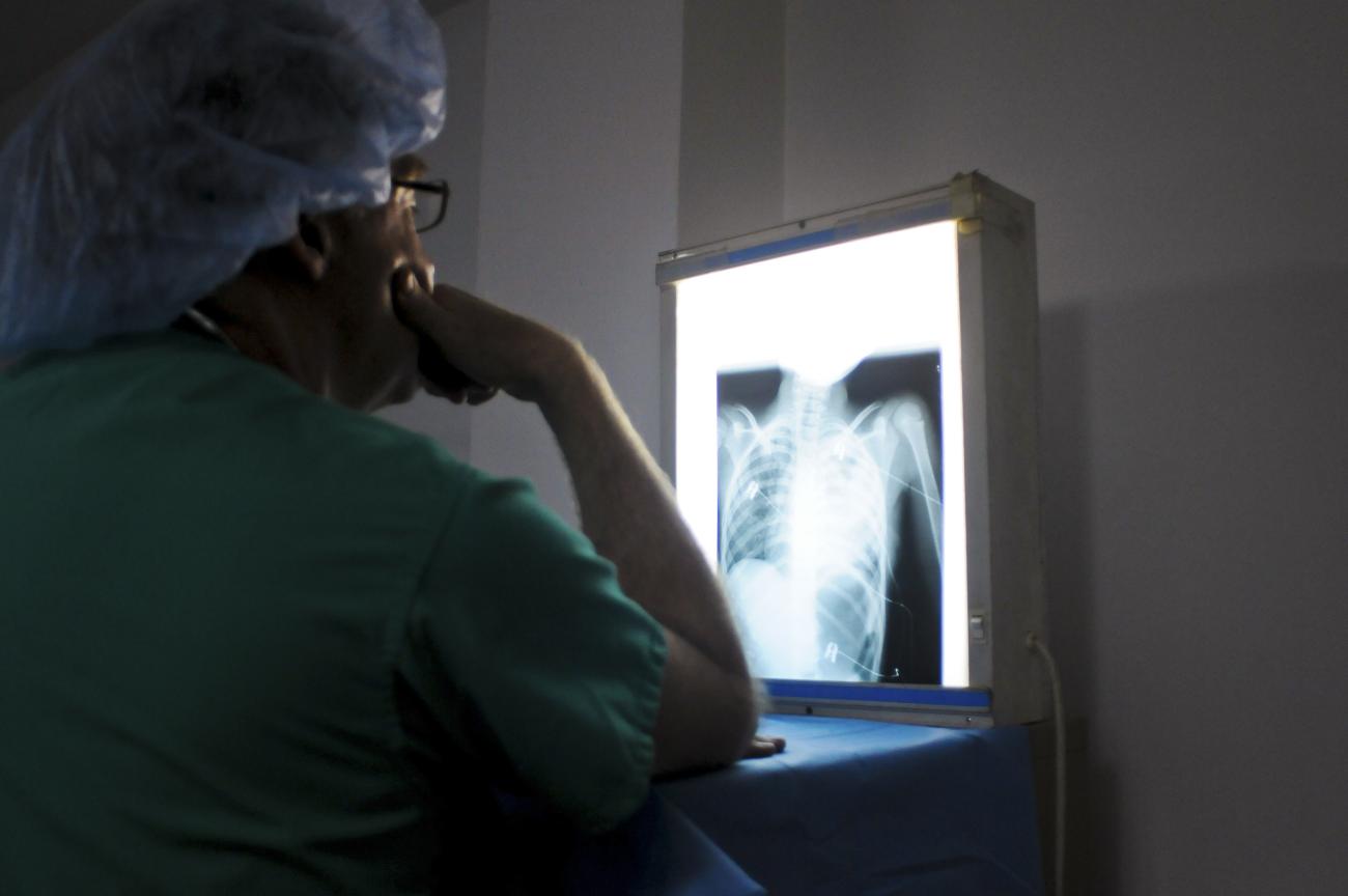 A doctor examines the X-ray of a patient's heart in the Degand Clinic.