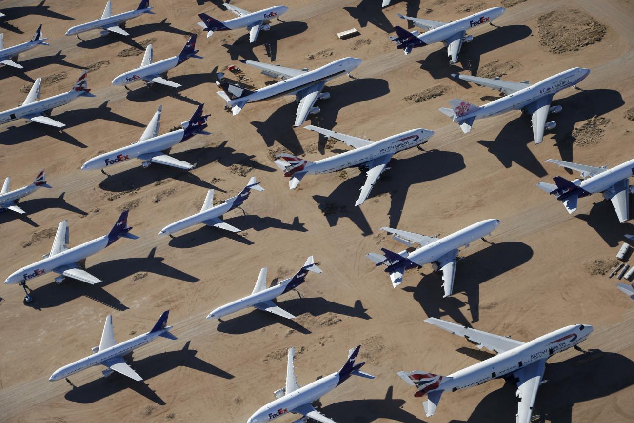 Old airplanes, including British Airways and China Airlines Boeing 747-400s and FedEx planes, are stored in the desert in Victorville, California, March 13, 2015.