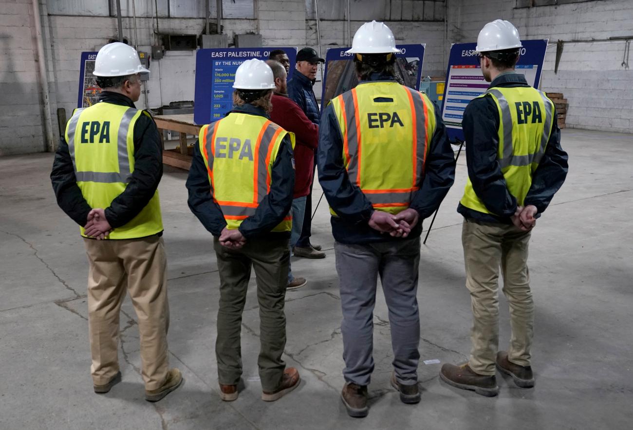 Environmental Protection Agency workers wait to meet with U.S. President Joe Biden during his visit to East Palestine, Ohio.