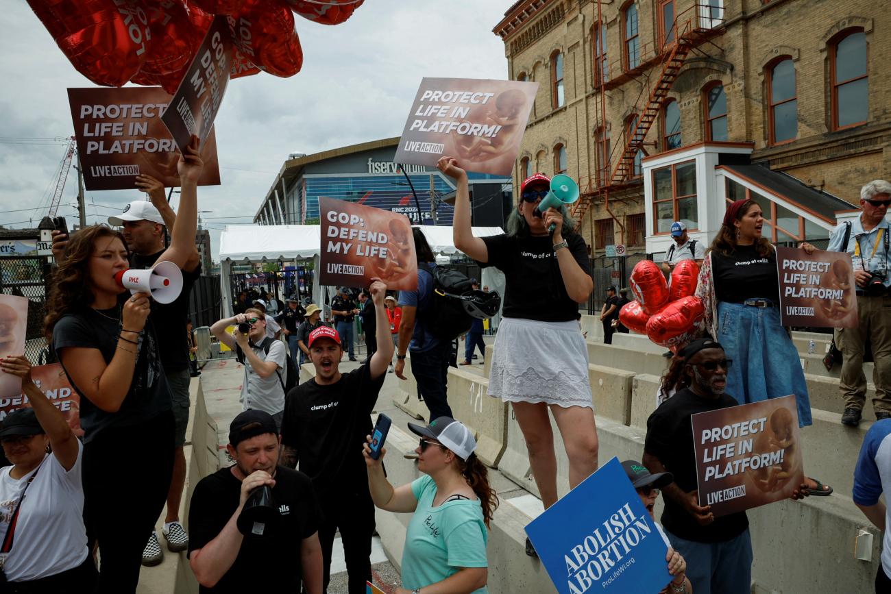 Anti-abortion campaigners demonstrate on the first day of the Republican National Convention.