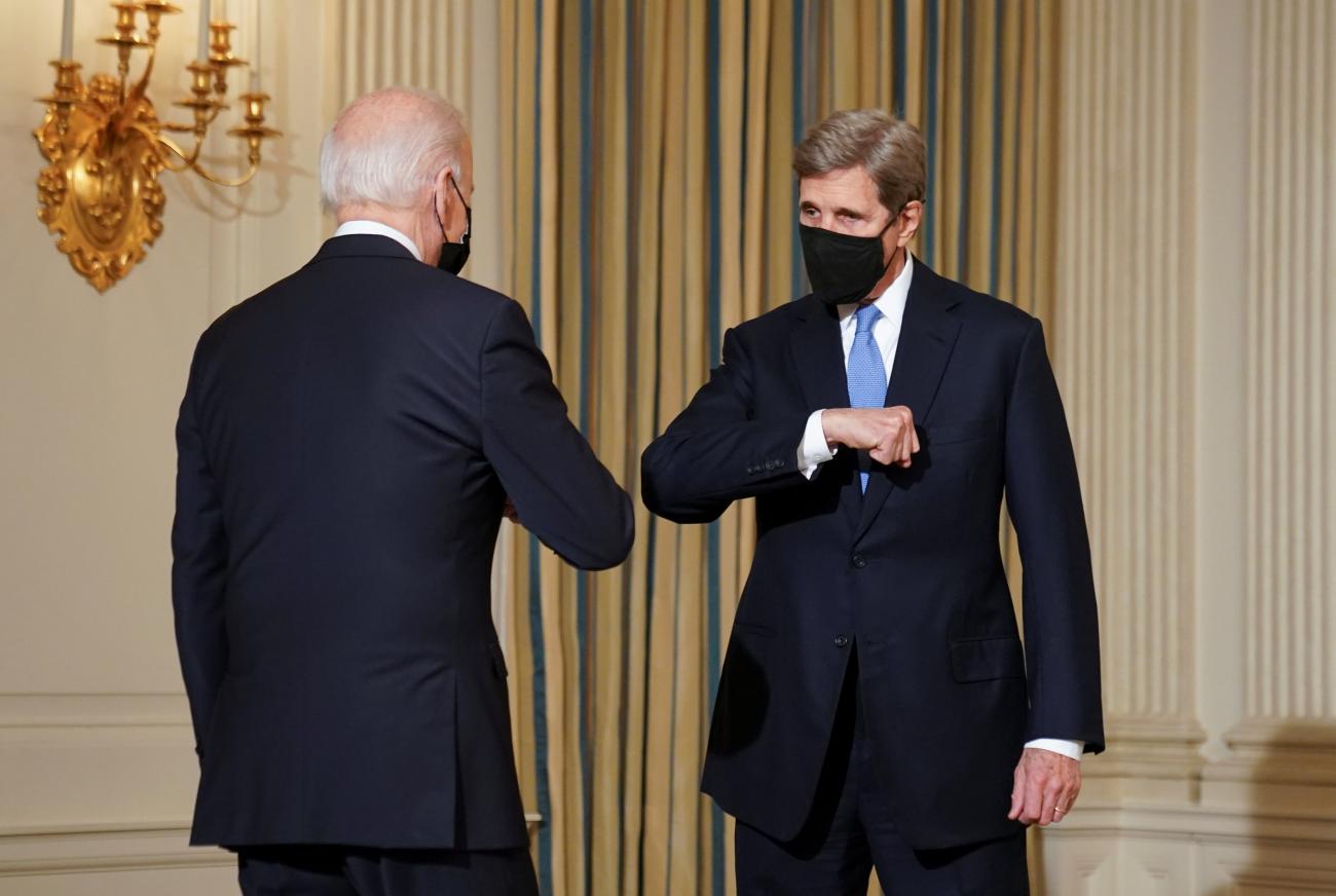 White House climate envoy John Kerry greets U.S. President Joe Biden as Biden arrives to speak about tackling climate at the White House in Washington, U.S., January 27, 2021. 