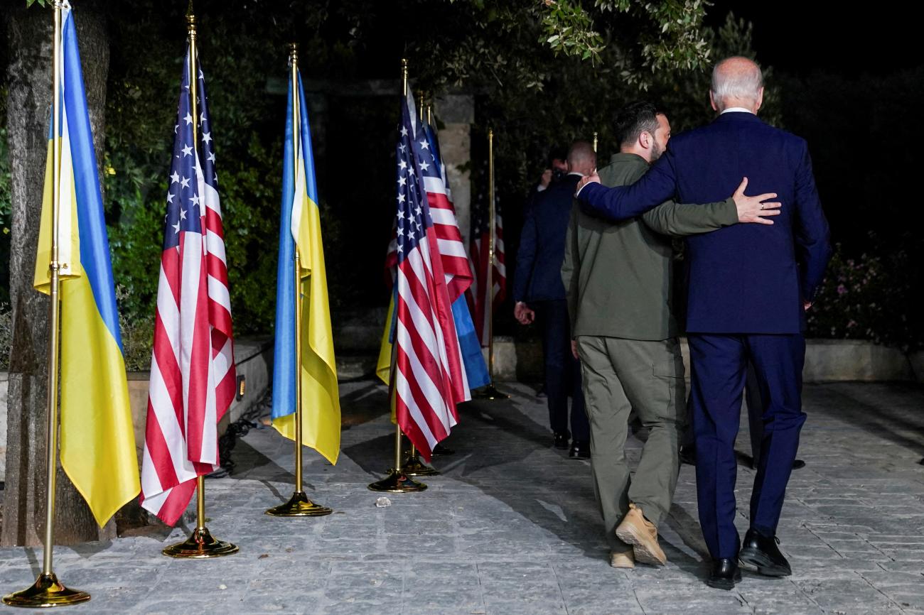 President Joe Biden and Ukrainian President Volodymyr Zelenskiy walk after a bilateral meeting on the sidelines of the G7 summit.