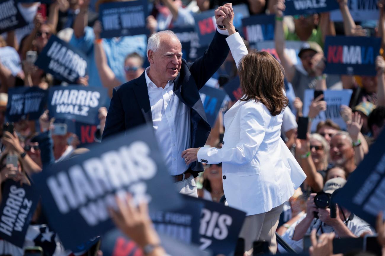 U.S. Vice President and Democratic presidential candidate Kamala Harris and her running mate Minnesota Governor Tim Walz celebrate during a campaign event in Eau Claire, Wisconsin, U.S., August 7, 2024. 