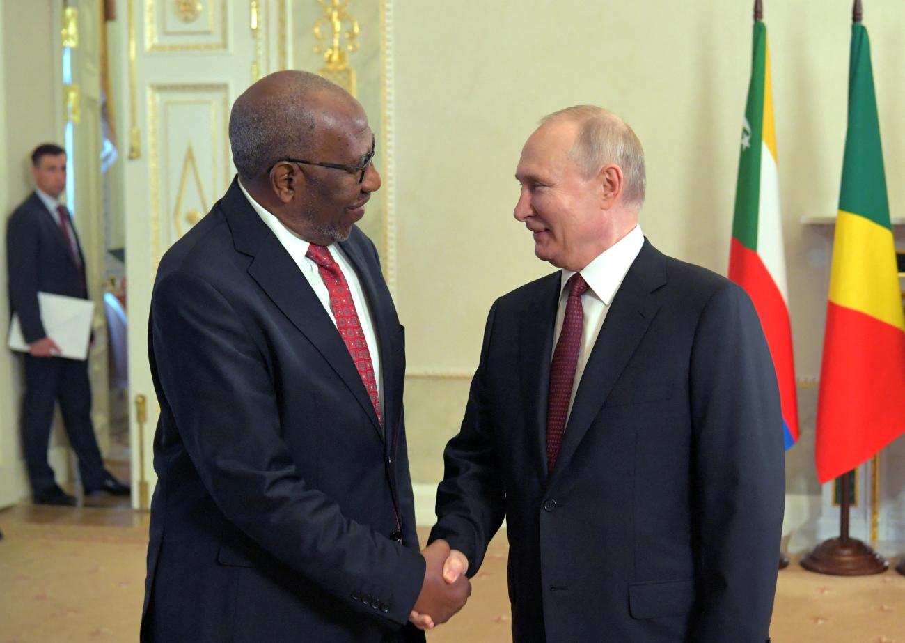 Russian President Vladimir Putin shakes hands with Ruhakana Rugunda, Special Envoy of the President of Uganda.