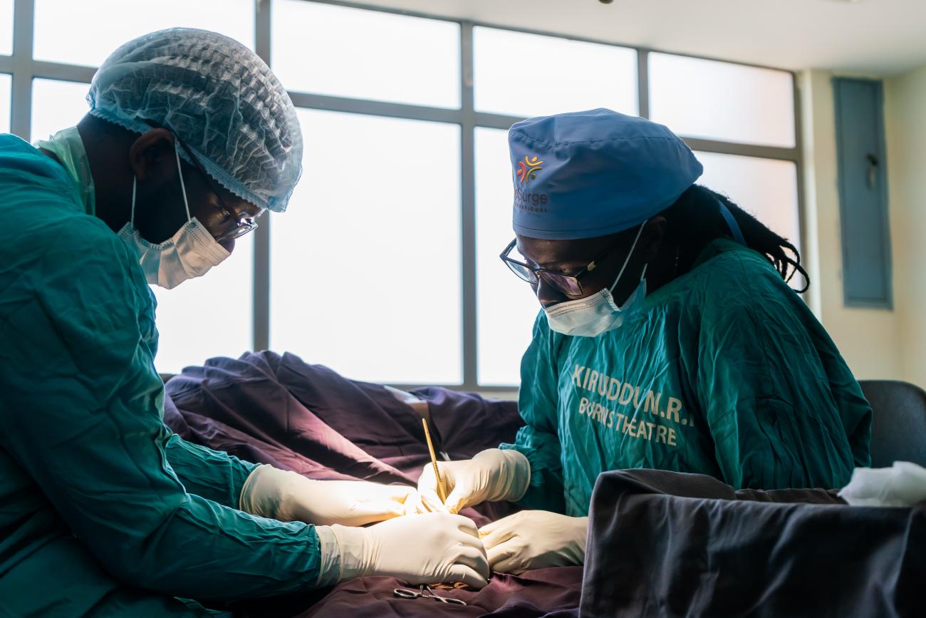 Rose Alenyo operates on a patient, at Kiruddu National Referral Hospital, in Kampala, Uganda.