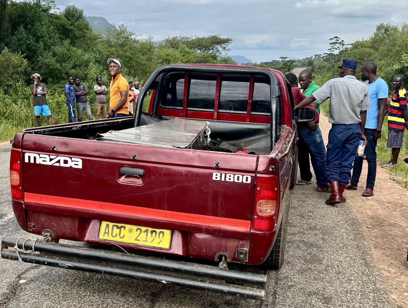 A car carrying a tin coffin is seen on a road in the Chimanimani mountains, near the border of Zimbabwe and Mozambique, in January 2024. 