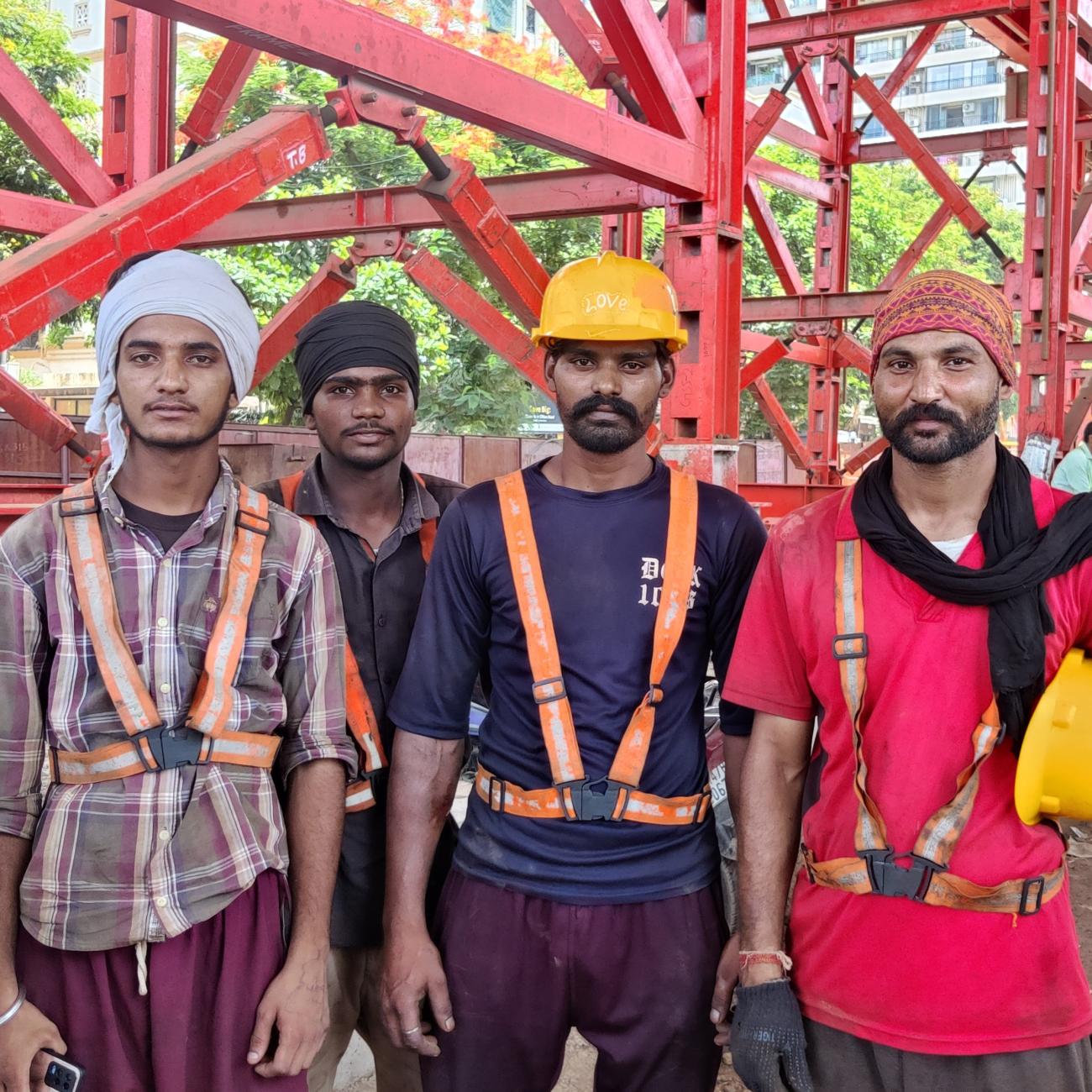 A group of construction workers stand for a photo.