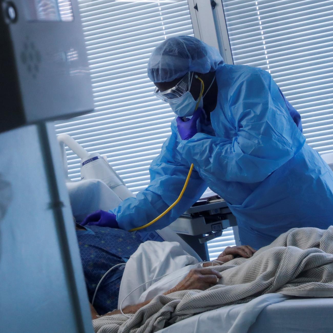 Registered Nurse LaToya Marks treats a COVID-19 positive patient at University of Arkansas for Medical Sciences.