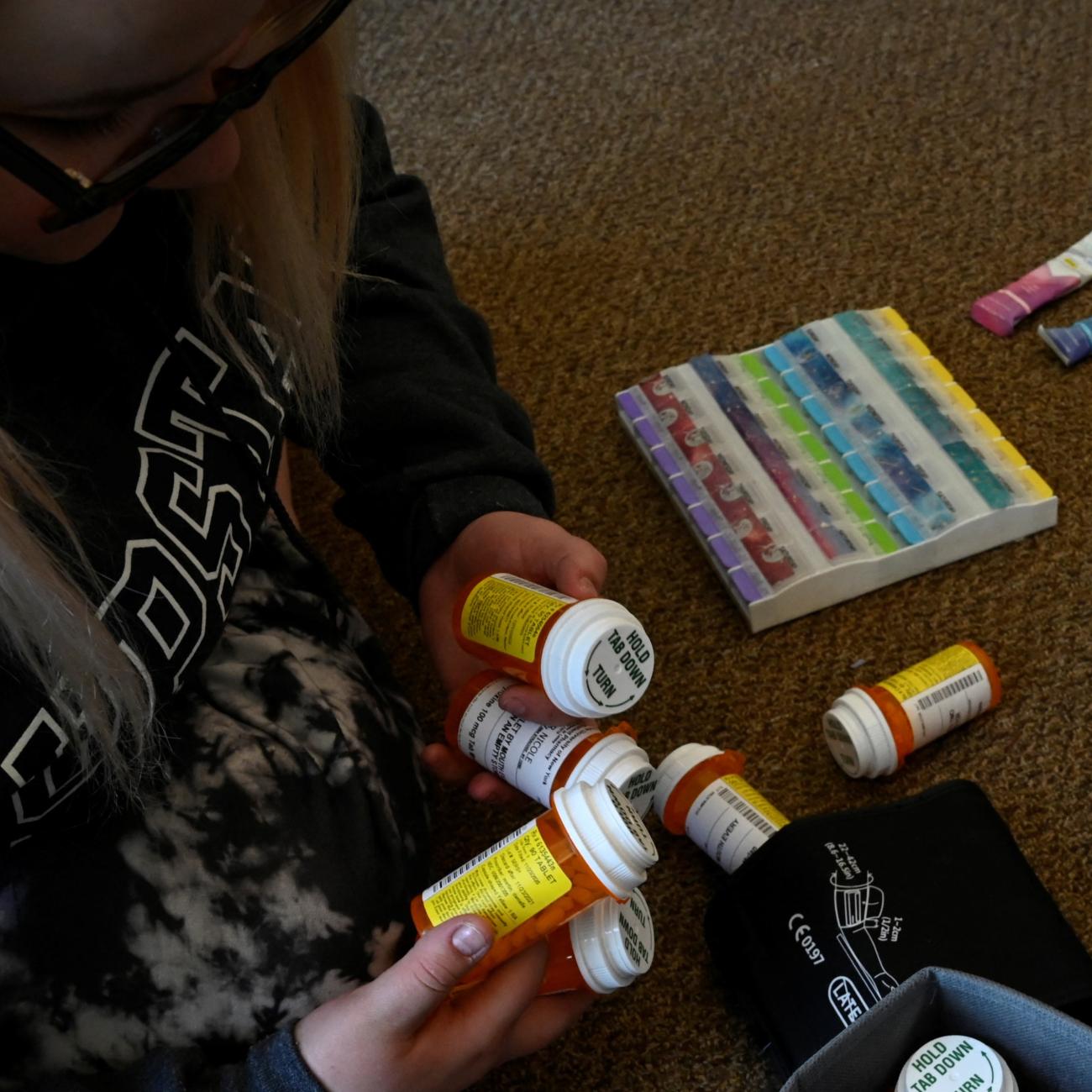 Nicole Spencer, 24, a medical student who suffers from Postural Orthostatic Tachycardia Syndrome (POTS), organizes her weekly medication.