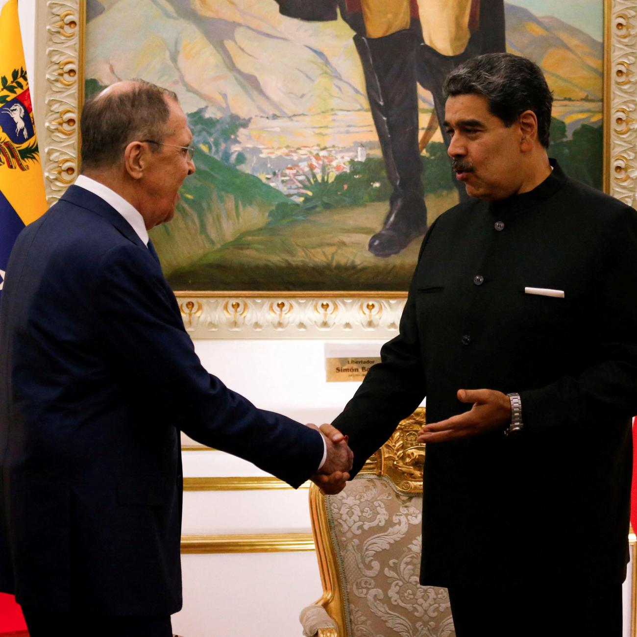 Venezuela's President Nicolas Maduro shakes hands with Russia's Foreign Minister Sergei Lavrov at Miraflores Palace, in Caracas, Venezuela February 20, 2024.