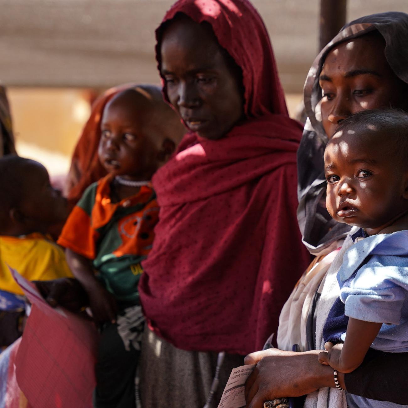 Women and babies are seen at the Zamzam displacement camp.