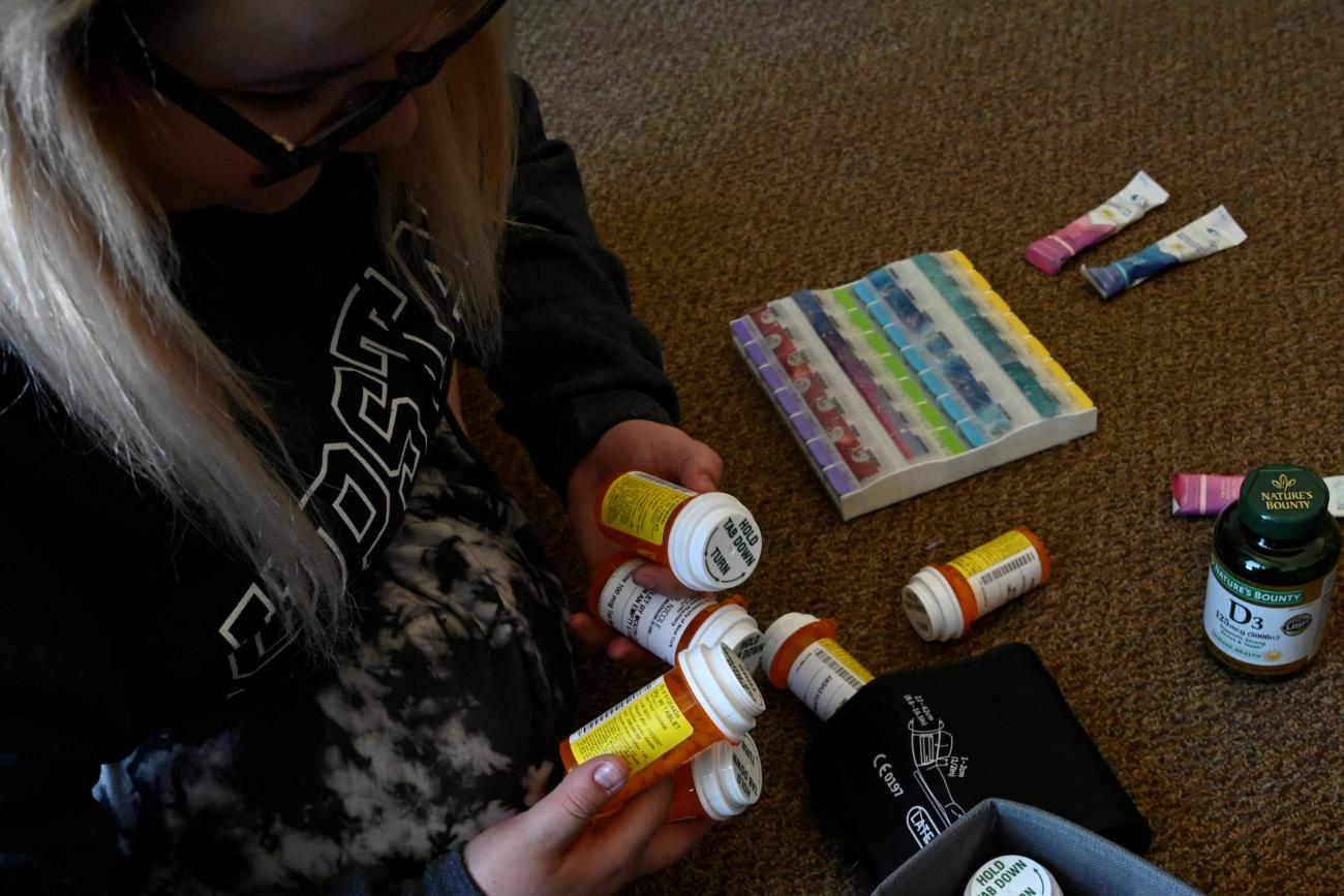 Nicole Spencer, 24, a medical student who suffers from Postural Orthostatic Tachycardia Syndrome (POTS), organizes her weekly medication.