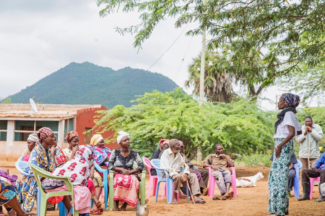 Lea Kilenga Masamo educates a group of people as part of an outreach effort for sickle cell disease. 