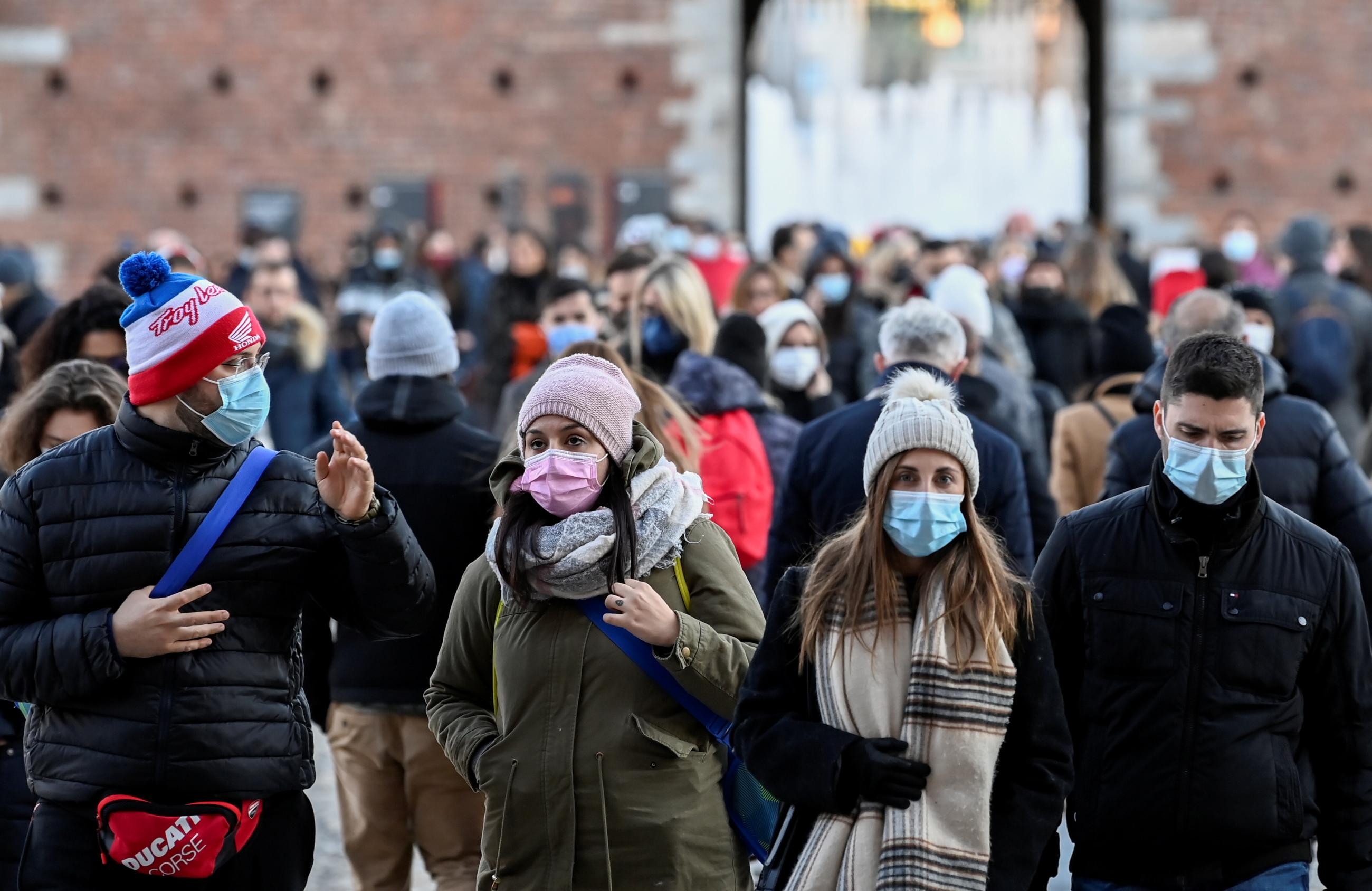People wear face masks amid the COVID-19 pandemic. 