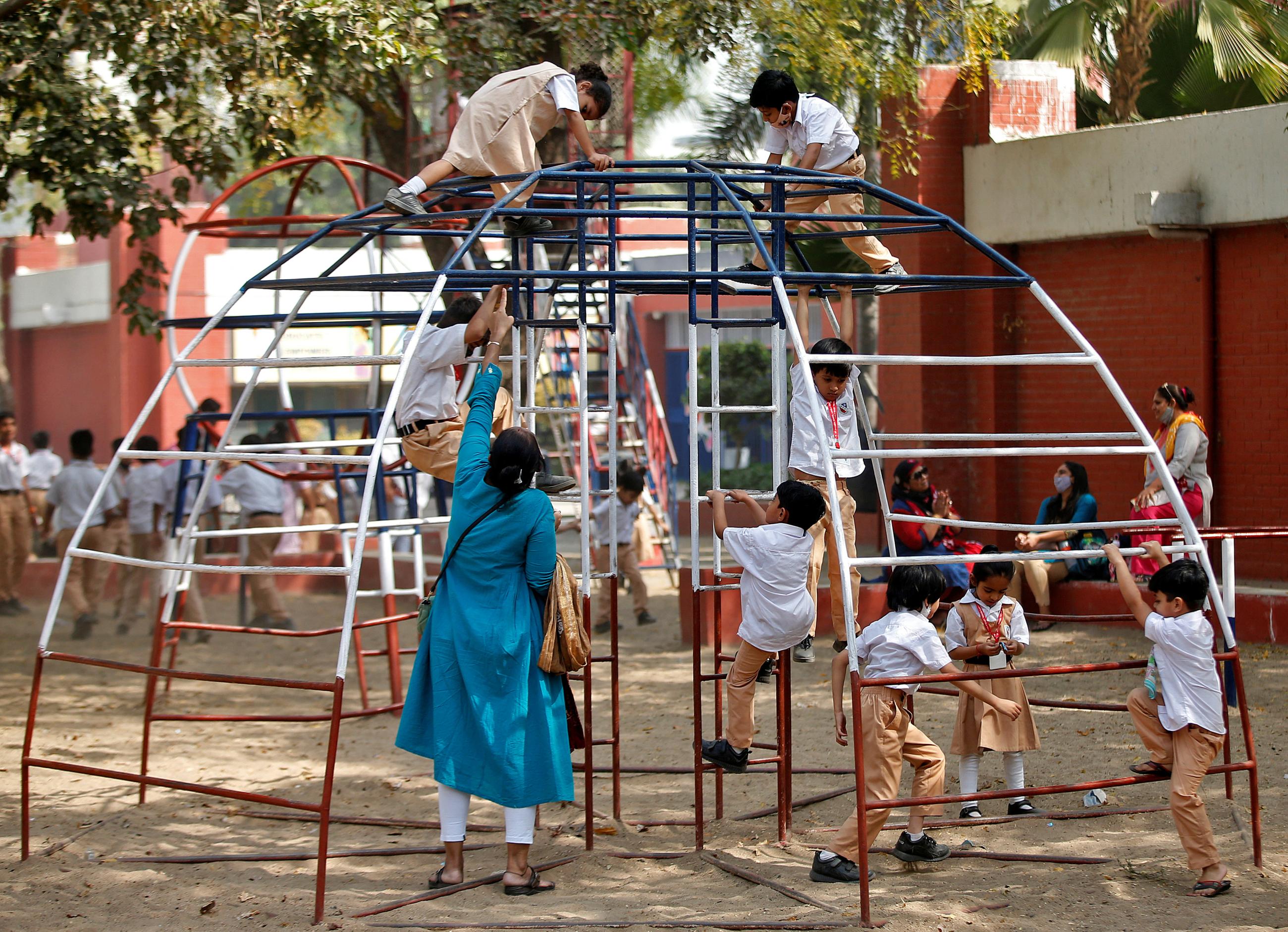 Students play during recess at a school.