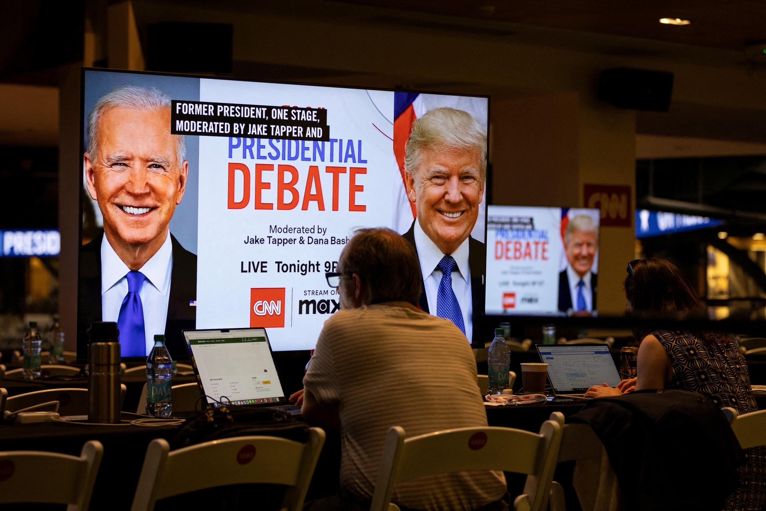 Media crews work at the press room in the McCamish Pavilion on the Georgia Institute of Technology campus ahead of the first 2024 presidential debate between U.S. President Joe Biden and former President Donald Trump in Atlanta, Georgia, June 27, 2024.
