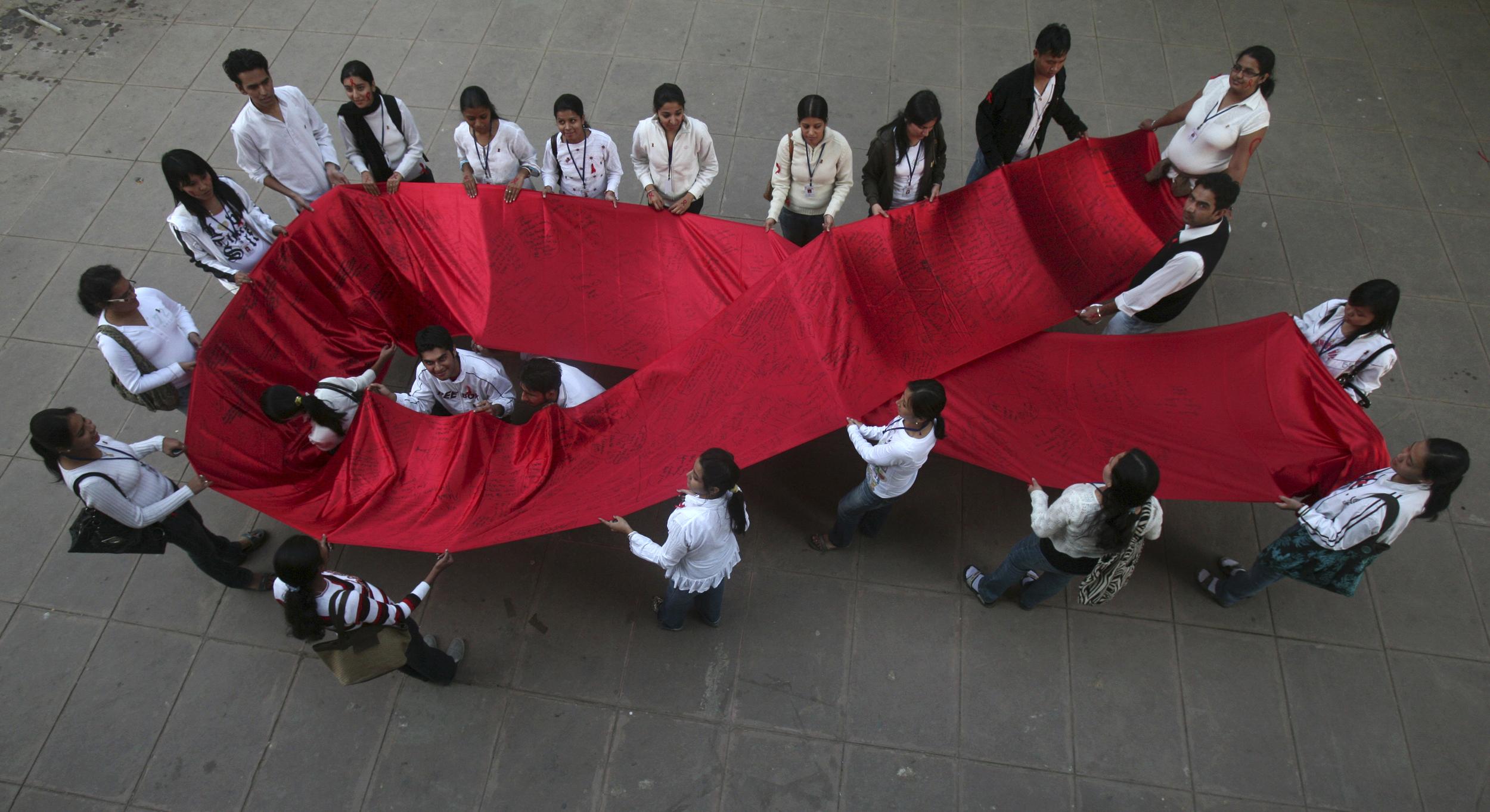 College students take part in a HIV/AIDS awareness campaign.