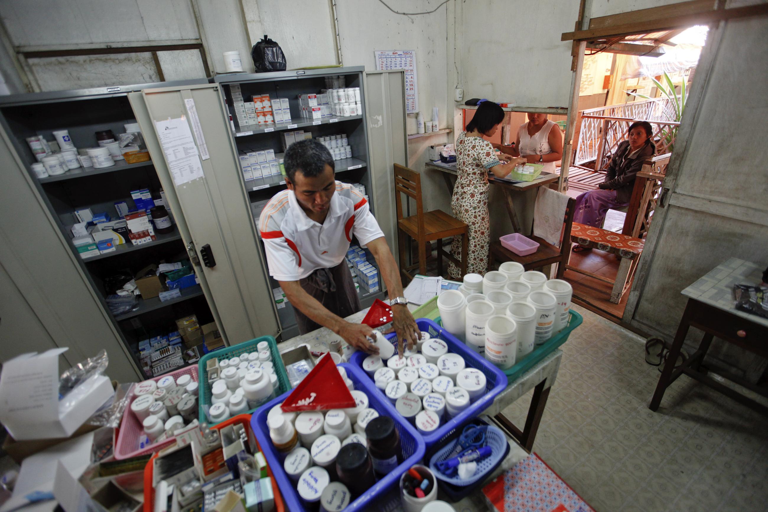 Pharmacists prepare medicine for two HIV-positive patients at Medecins Sans Frontieres-Holland's clinic.