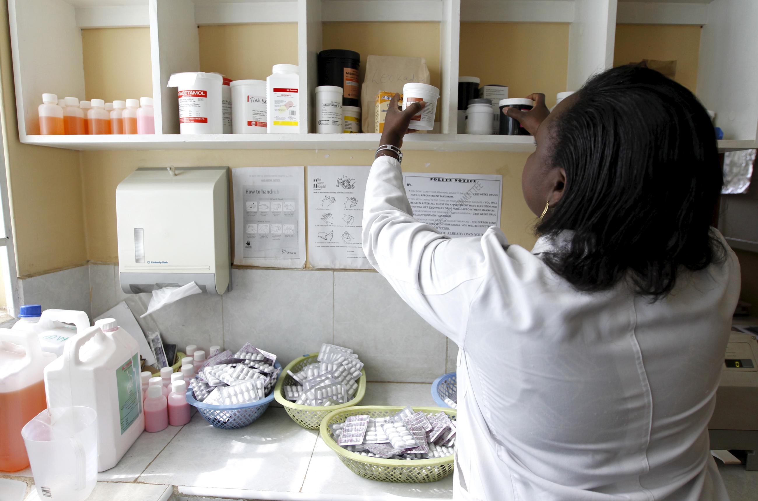 Ruth Munyao, a pharmacist, dispenses antiretroviral (ARV) drugs.