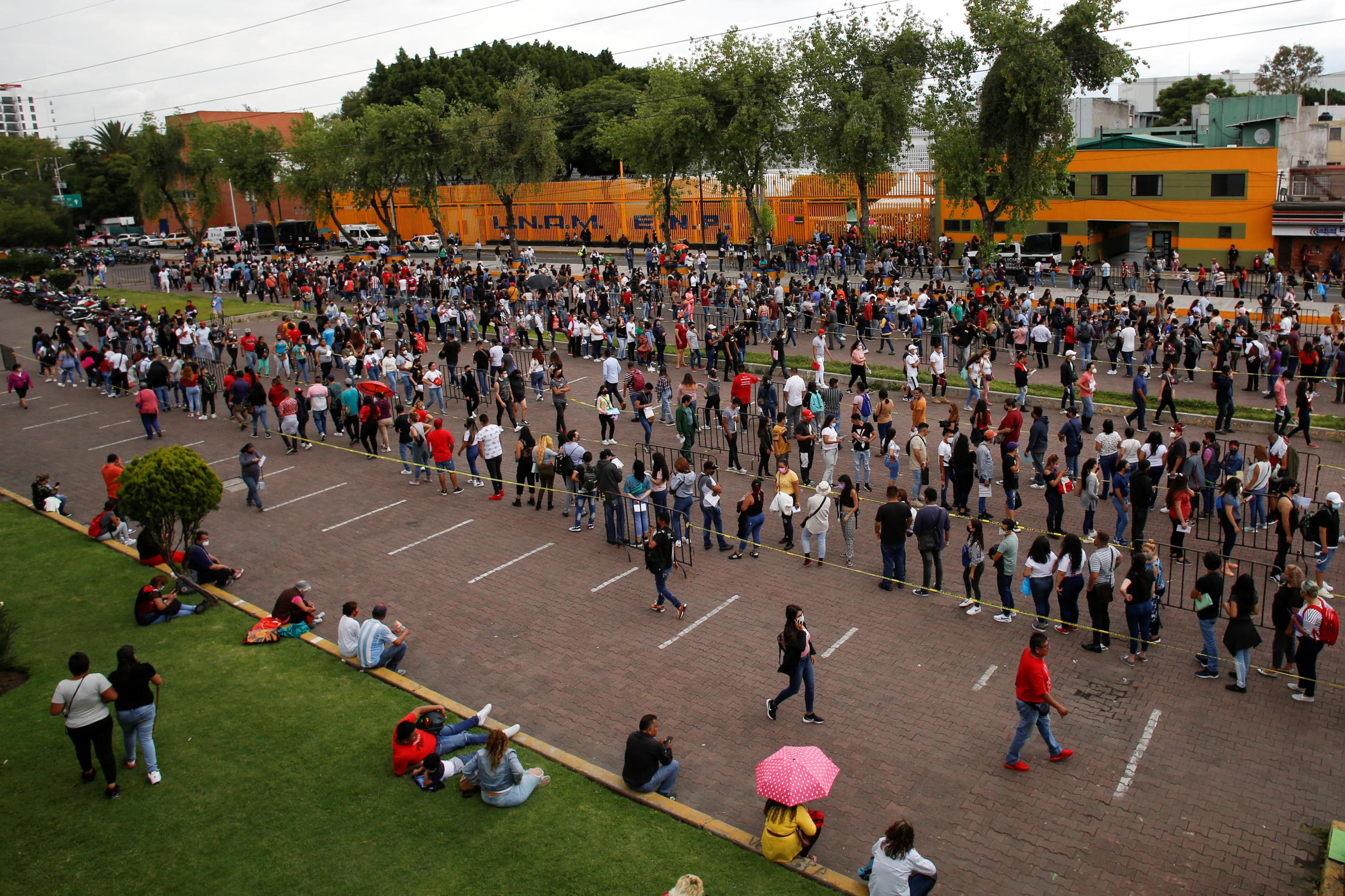 People, between 18 and 29, line up to receive a dose of the Sputnik V COVID-19 vaccine, in Mexico City, Mexico, on July 30, 2021.