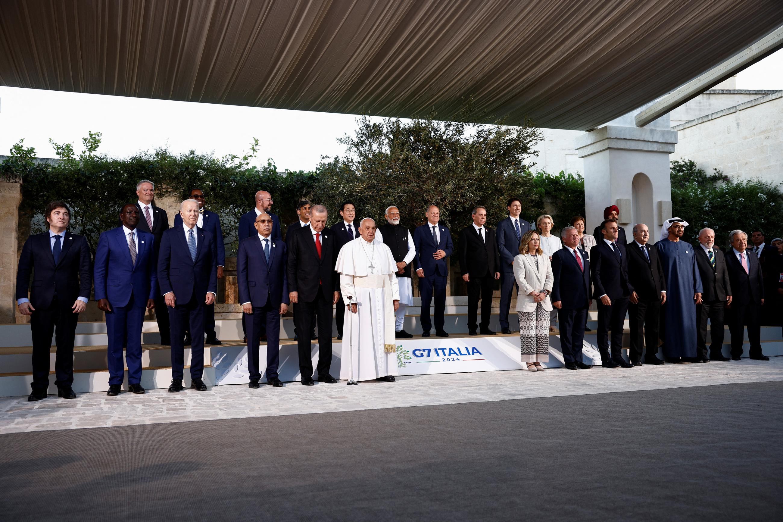 Attendees of the G7 summit pose for a photo at the Borgo Egnazia resort.