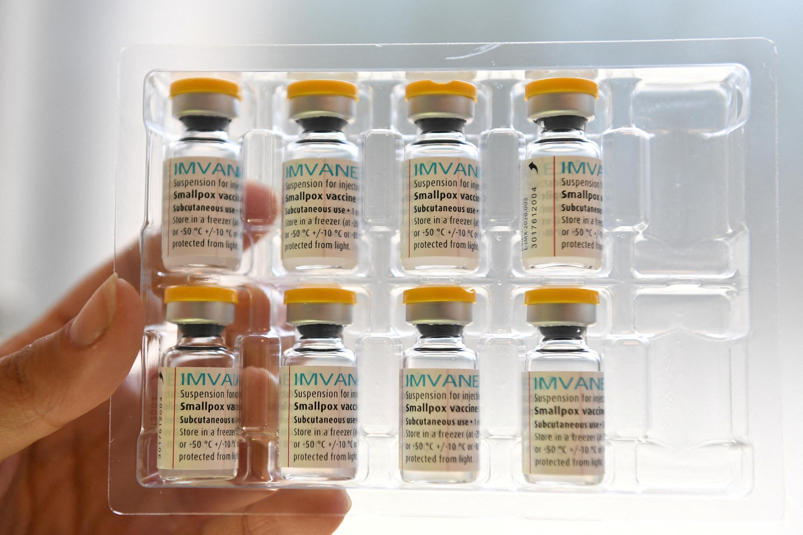 A person holds doses of Bavarian Nordic's Imvanex vaccine, which is used to protect against mpox virus.