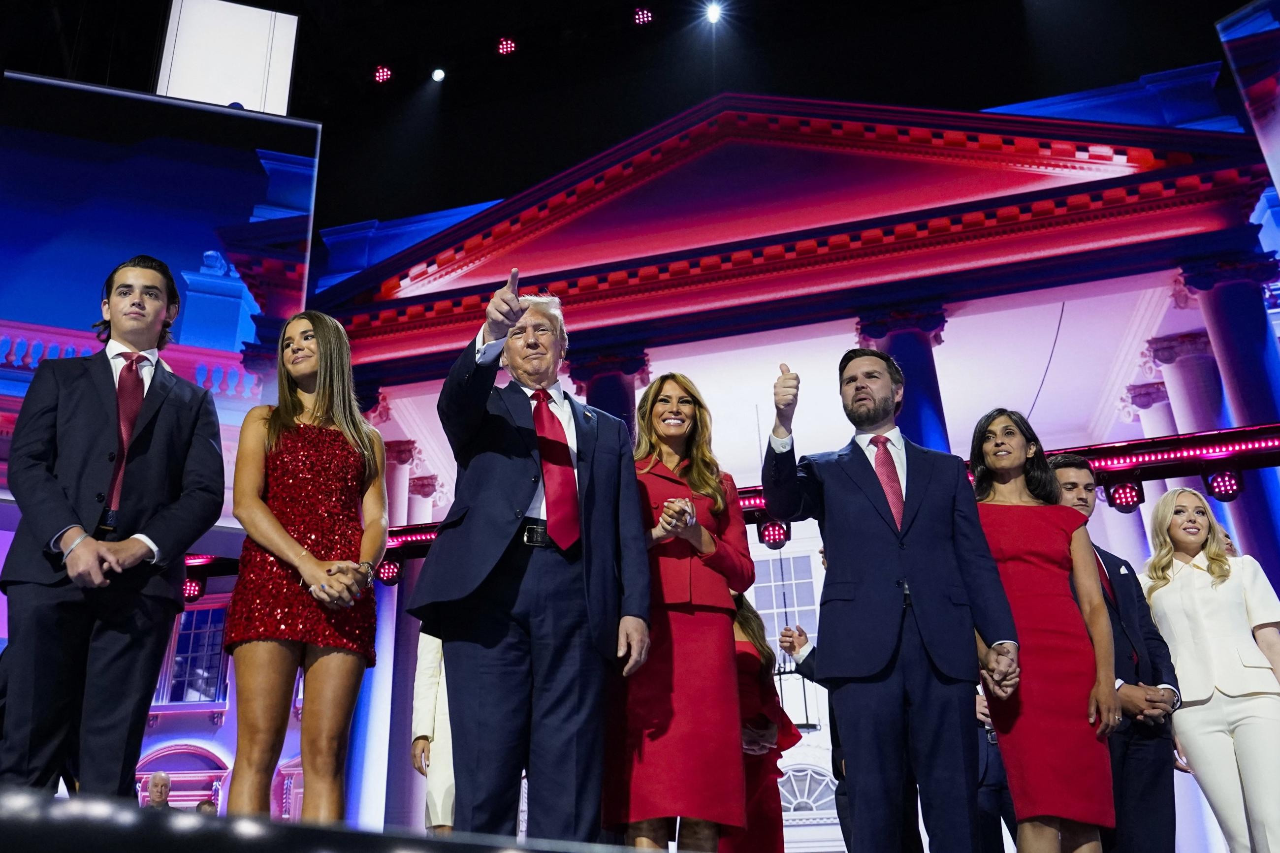 Republican presidential nominee and former President Donald Trump and Republican vice presidential nominee J.D. Vance stand on stage with their families.