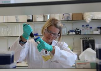 Rhiannon Evans, head of Enzyme Production and Molecular Biology at biotechnology research company HydRegen, works in their laboratory facility.