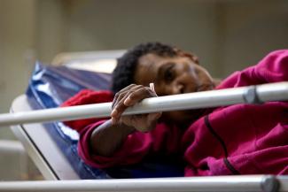 A patient waits in the emergency room of Klerksdorp Tshepong public district hospital.