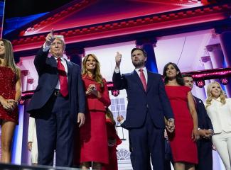 Republican presidential nominee and former President Donald Trump and Republican vice presidential nominee J.D. Vance stand on stage with their families.