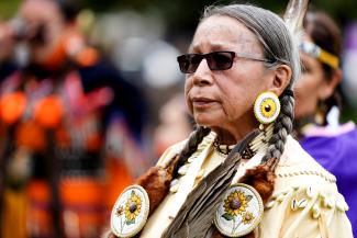 Cynthia King, from G'Chimnissing, stands during the first National Day for Truth and Reconciliation.