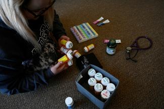 Nicole Spencer, 24, a medical student who suffers from Postural Orthostatic Tachycardia Syndrome (POTS), organizes her weekly medication