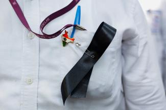 A doctor wears a ribbon and an India map badge on his shirt, during a protest demanding justice following the murder of a trainee medic, at a hospital in Kolkata, New Delhi, India, on August 16, 2024.